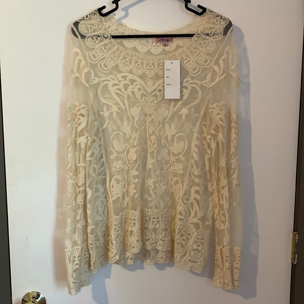 Cream white lace top.